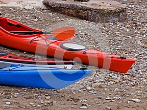 Hulls of Kayaks on the Shore