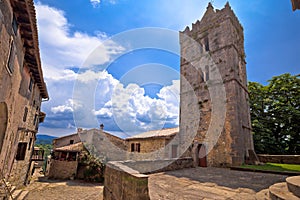 Hum. Historic stone square and church in smallest town in the World Hum
