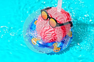 Human Brain in Sunglasses Cools Off Under Water Spray in the Pool