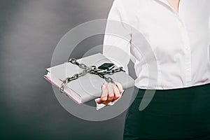 Human with chained document file.
