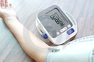 Human check blood pressure monitor and heart rate monitor with digital pressure gauge. Health care and  Medical concept