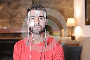 Human connected to the cyberspace with electrodes and wires