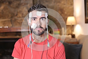 Human connected to the cyberspace with electrodes and wires