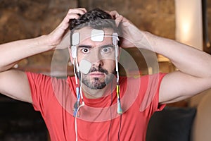 Human connected to the cyberspace with electrodes and wires