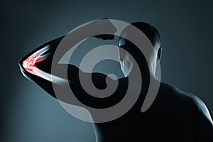 Human elbow joint in x-ray, on gray background