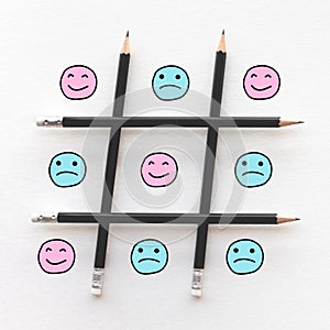 Human emotion concepts with emoticon face happy and sad in game line pattern