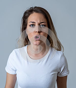 Human expressions and emotions. Desperate young attractive woman with angry face looking furious