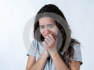 Human expressions and emotions. Young attractive teenager girl looking scared and shocked