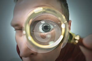 Human eye through a magnifying glass.