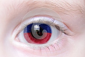 Human eye with national flag of haiti
