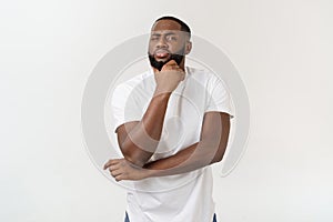 Human face expressions, emotions and feelings. Handsome young African American man looking up with thoughtful