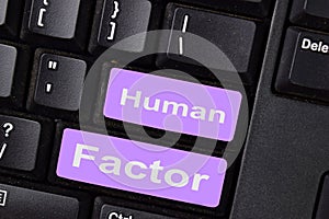 Human Factor write on keyboard isolated on laptop background photo