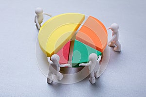 Human Figures Connecting Pieces Of Pie Chart