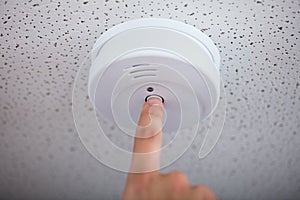 Human Finger Testing Smoke Detector