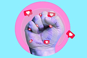 Human fist with likes as a concept of social media addiction