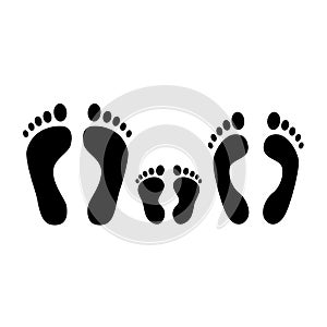 Human footprint. Black silhouette of man, woman and baby footprints. Family. Vector icons isolated on white photo