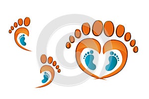 Human footprints of adult man with baby footprints. Child care. Footprints of an adult foot forming a heart