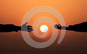 Human hand Asking help Concept. hands helping each other Against Sunset background. People helping, God salvation and Get Hired