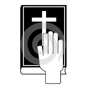 Human hand on the Bible