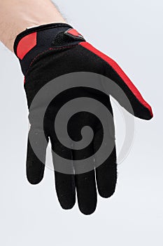 Human hand in black sport glove