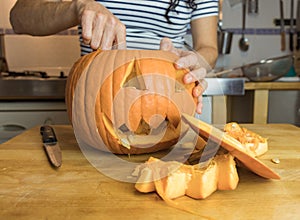 Human hand cleaning pumpkin