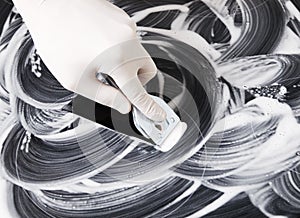 Human hand cleaning a vitroceramic