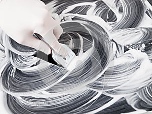 Human hand cleaning a vitroceramic