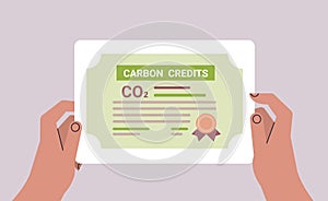 human hand CO2 limit emissions certificate net zero emission carbon credit offset concept photo