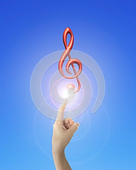 Human hand forefinger pointing music note with bright light