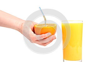 Human hand and fresh juicy orange
