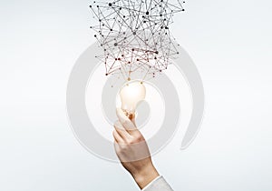 Human hand with glowing lamp and abstract network