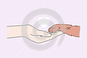 Human hand hold pet paw show love