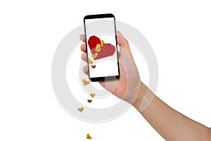 Human hand hold smartphone with blank screen and red broken heart icon with falling hearts.