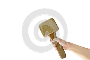 Human hand holding big wooden hammer on white background