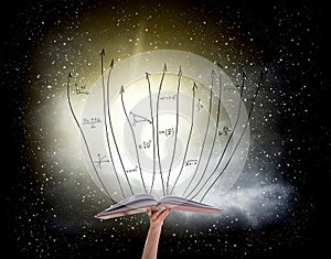 Human hand holding book