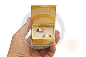 Human hand holding a box with rings