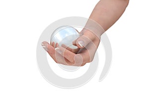 Human hand holding bright sphere