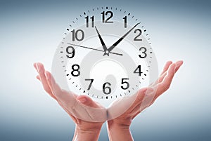 Human Hand Holding Clock Time on white