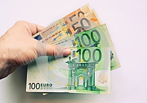 Human hand holding Euros photo