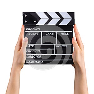 Human hand holding film clapper board isolated on white background