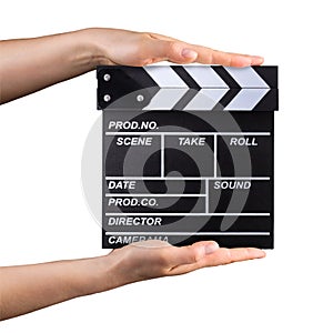 Human hand holding film clapper board isolated on white background with clipping path