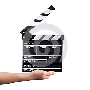 Human hand holding film clapper board isolated on white background with clipping path