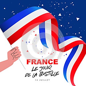 Human hand is holding a French flag. Bastille Day on July 14 - inscription in French. National holiday in France