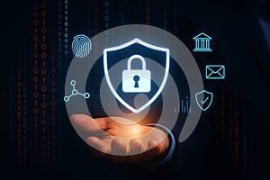 Human hand holding glowing digital security icons and binary code background