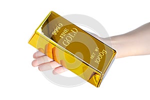 Hand holding gold bar 1kg photo