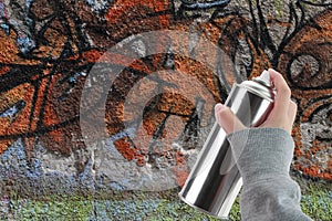 Human hand holding a graffiti Spray can