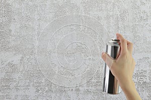 Human hand holding a graffiti Spray can