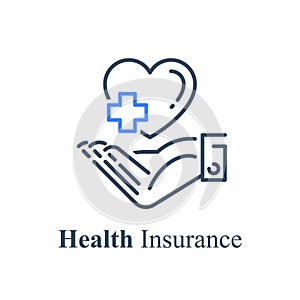 Human hand holding heart and cross, health care concept, medical help, non profit charity fund