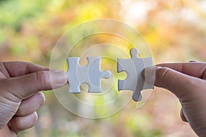 Human Hand Holding Jigsaw Puzzle Business Connection photo