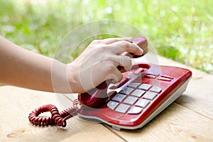 Human hand holding phone, closeup picture